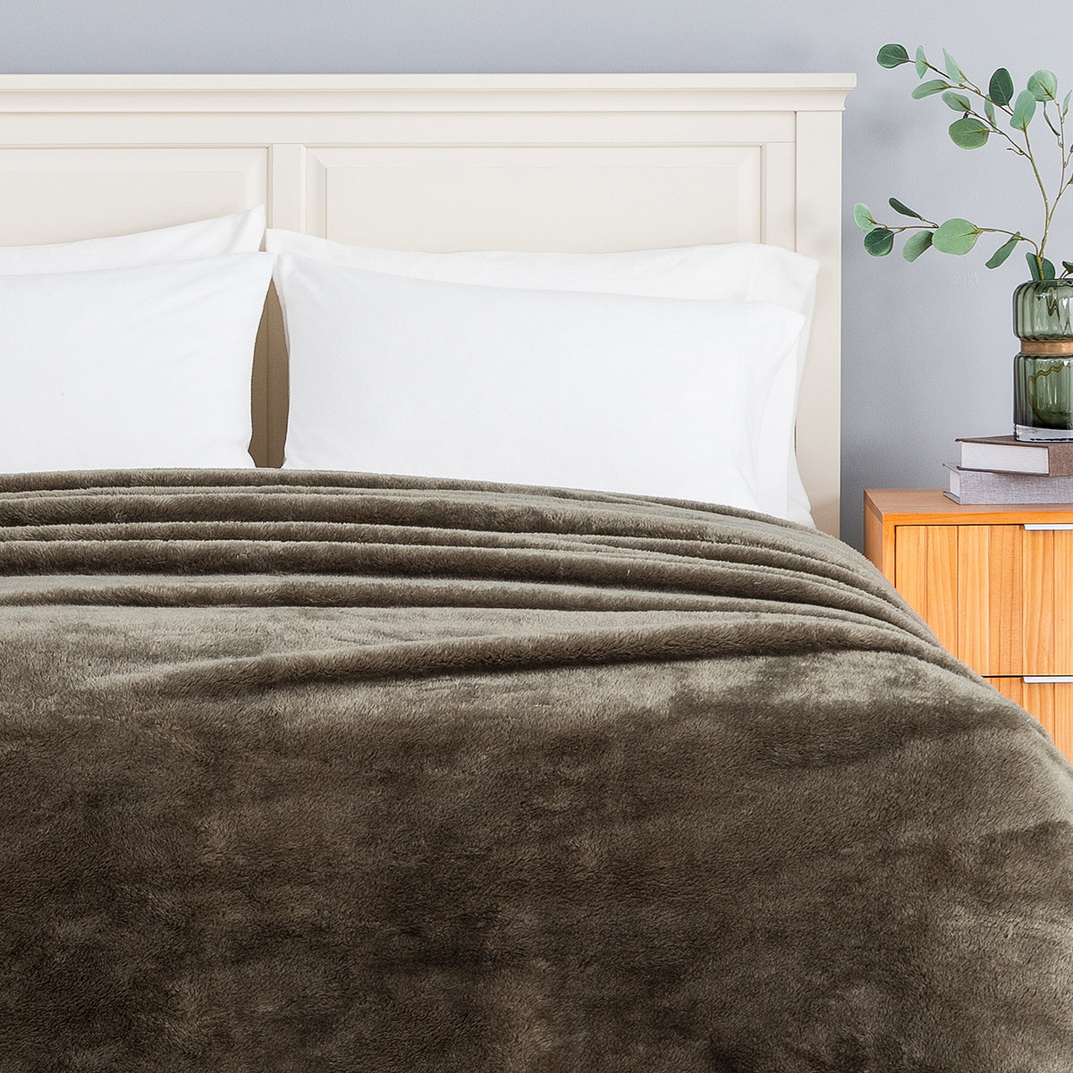 Premium Extra-Fluffy™ Blanket in Kalamata turned down at the head of a bed, close view