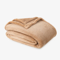 Premium Extra-Fluffy™ Blanket in Prosecco, folded on a white background