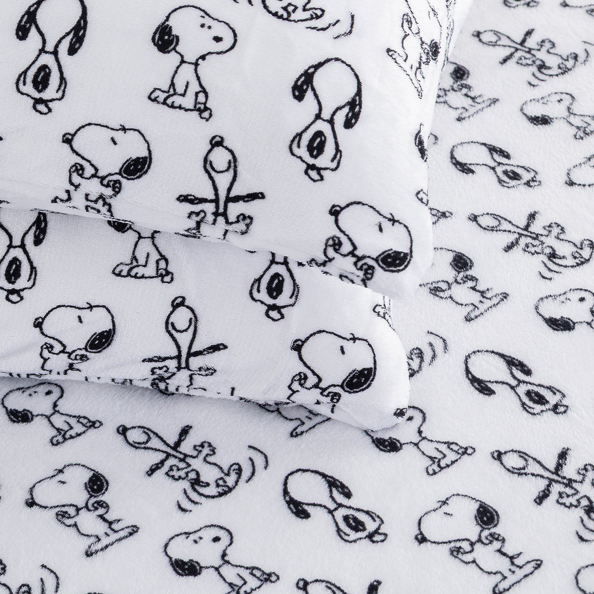 Close up of black  and white Peanuts printed VelvetLoft Sheets.