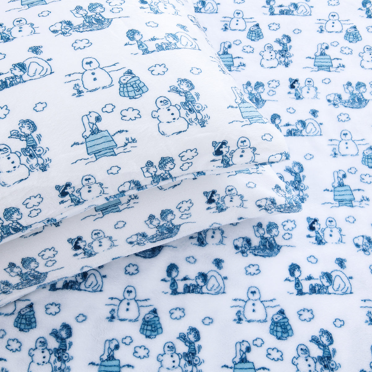 Close up of Peanuts white and blue holiday printed VelvetLoft sheet set.