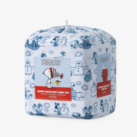 Peanuts white and blue holiday printed VelvetLoft sheet set in its packaging on a white surface.