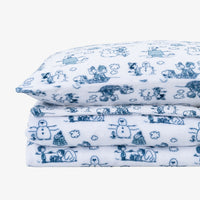 Peanuts white and blue holiday printed VelvetLoft sheet set folded neatly on a white surface.