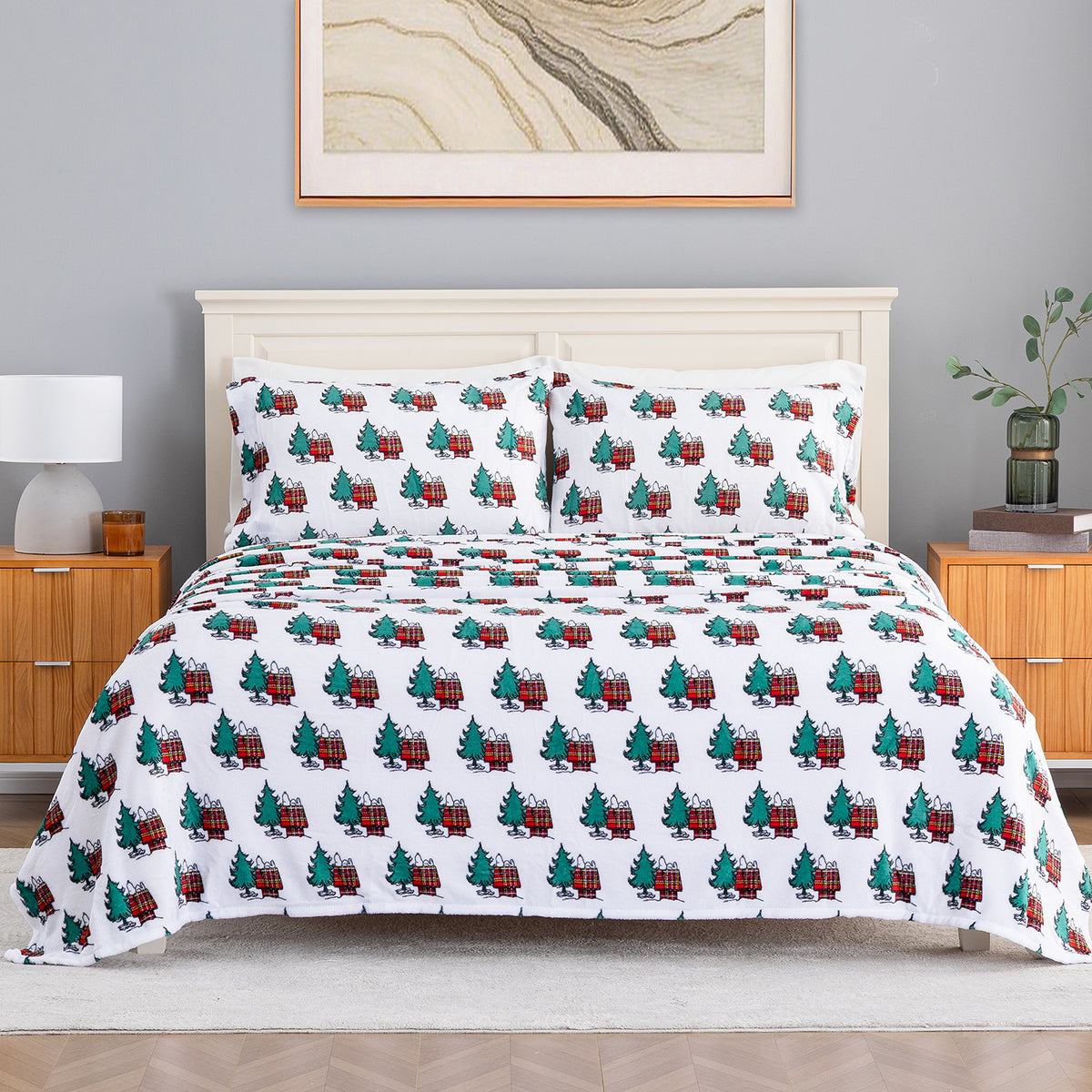 Peanuts holiday printed VelvetLoft sheet set dressed neatly on a bed.