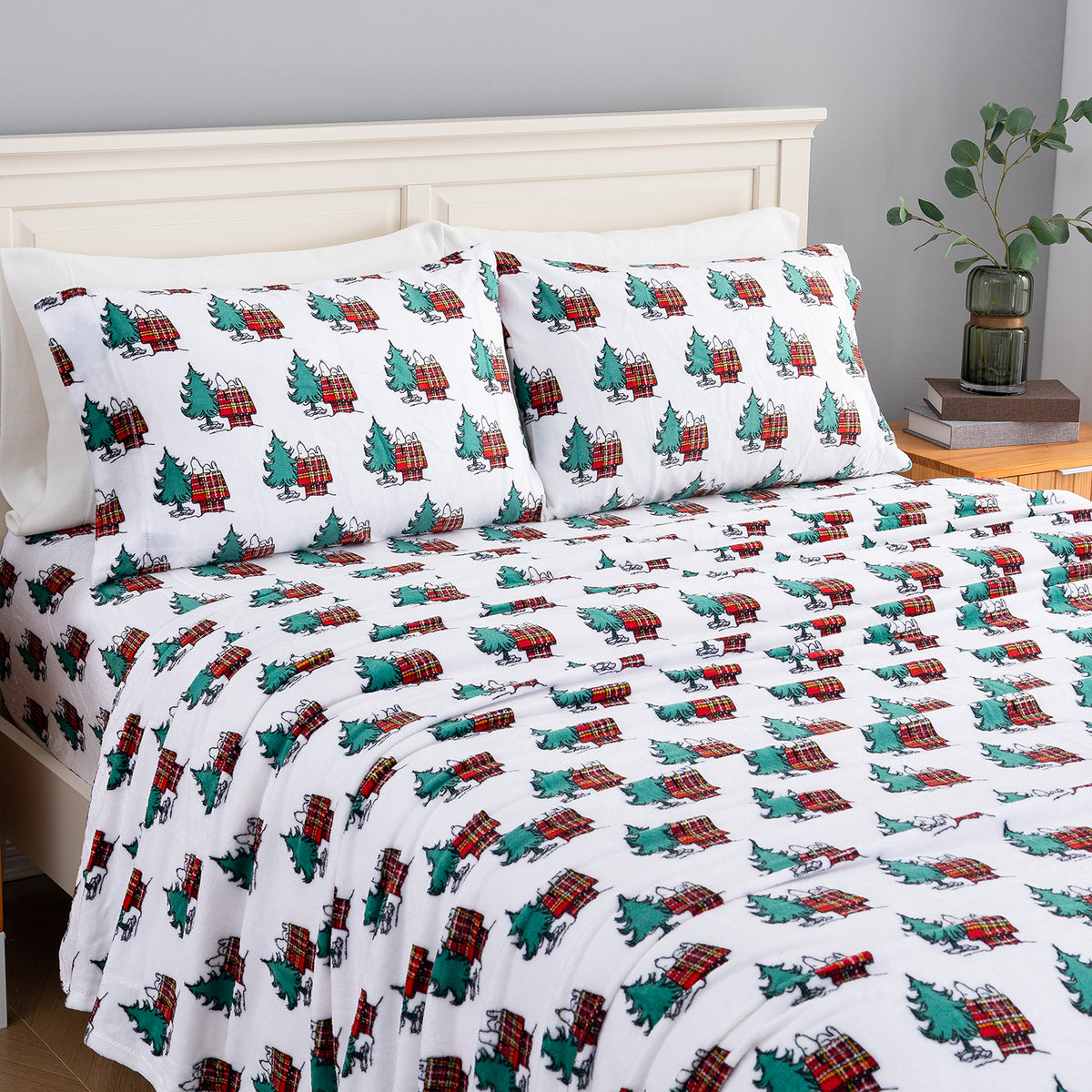 Peanuts holiday printed VelvetLoft sheet set dressed neatly on a bed.
