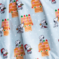 Close up of a blue gingerbread holiday Peanuts Printed VelvetLoft Throw 