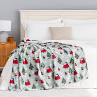 A holiday Peanuts Printed VelvetLoft Throw draped neatly over a bed.