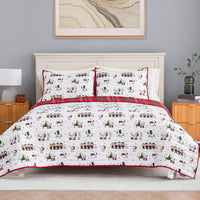 A festive holiday-themed bedding set featuring a white comforter and matching pillow shams with a repeating cartoon character print and red plaid trim, styled on a bed in a bedroom setting.