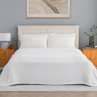 VelvetLoft® Plush Sheet Set in Cream on a made bed with a cream headboard, front view