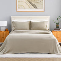 VelvetLoft® Plush Sheet Set in Dry Sage on a made bed with a cream headboard, front view