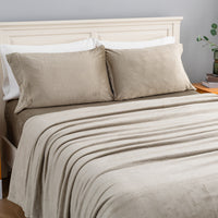 VelvetLoft® Plush Sheet Set in Dry Sage on a made bed, angled view