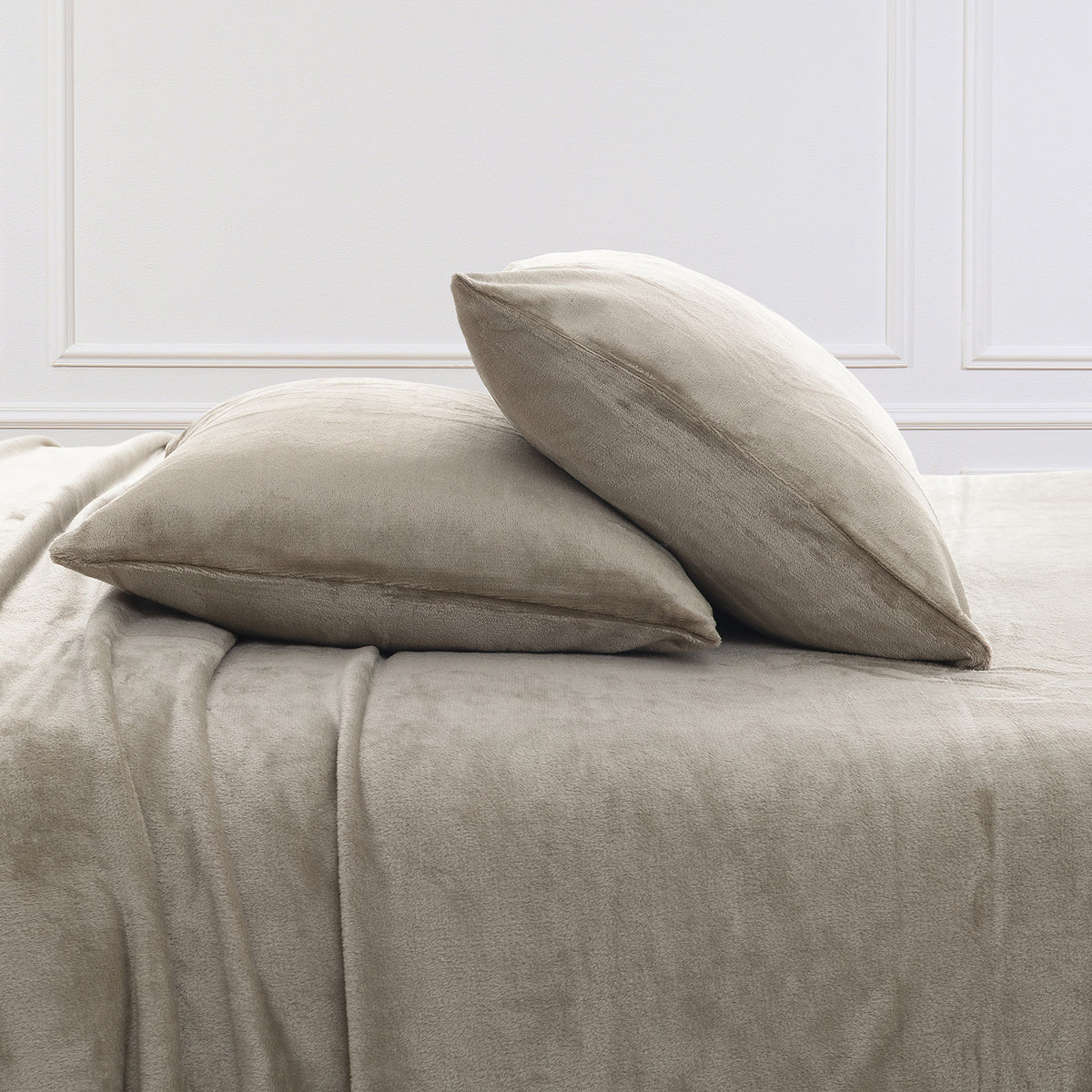 VelvetLoft® Plush Sheet Set pillowcases in Dry Sage on a made bed against a white paneled wall