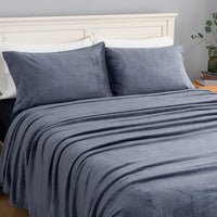 VelvetLoft® Plush Sheet Set in Galaxy Blue on a made bed, angled view