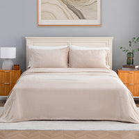 VelvetLoft® Plush Sheet Set in Hummus on a made bed with a cream headboard, front view