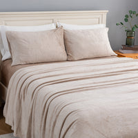 VelvetLoft® Plush Sheet Set in Hummus on a made bed, angled view