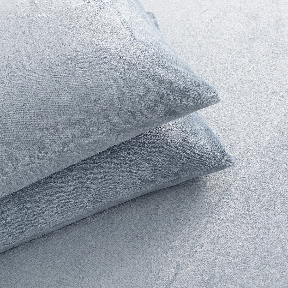Close-up of VelvetLoft® Plush Sheet Set pillowcases in Polar Blue