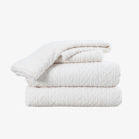 VelvetLoft® Plush Sheet Set in Textured Cream, folded on a white background