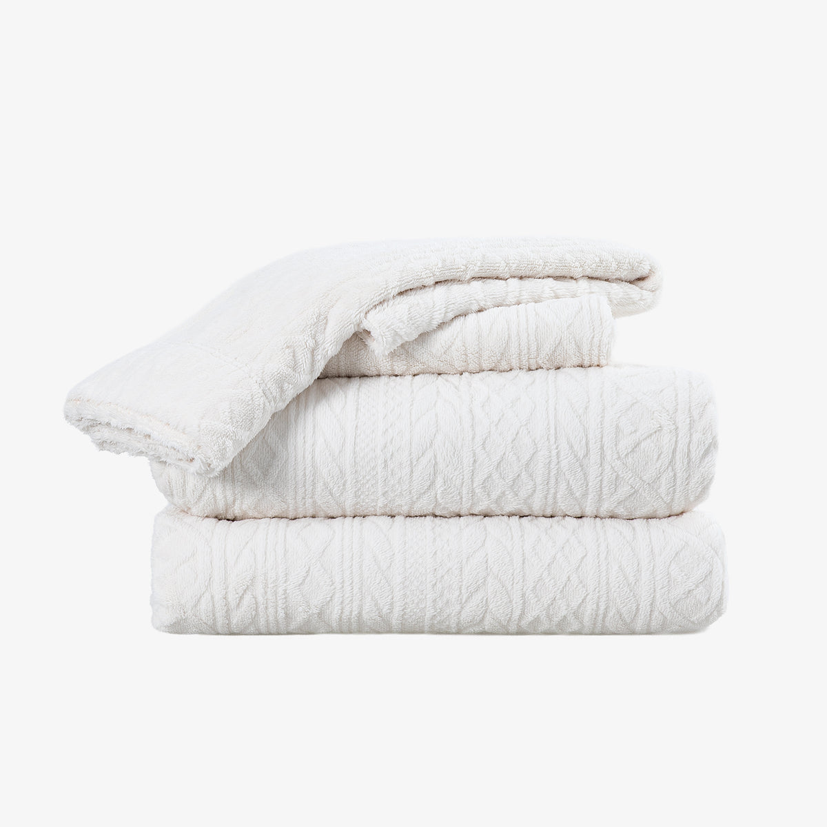 VelvetLoft® Plush Sheet Set in Textured Cream, folded on a white background