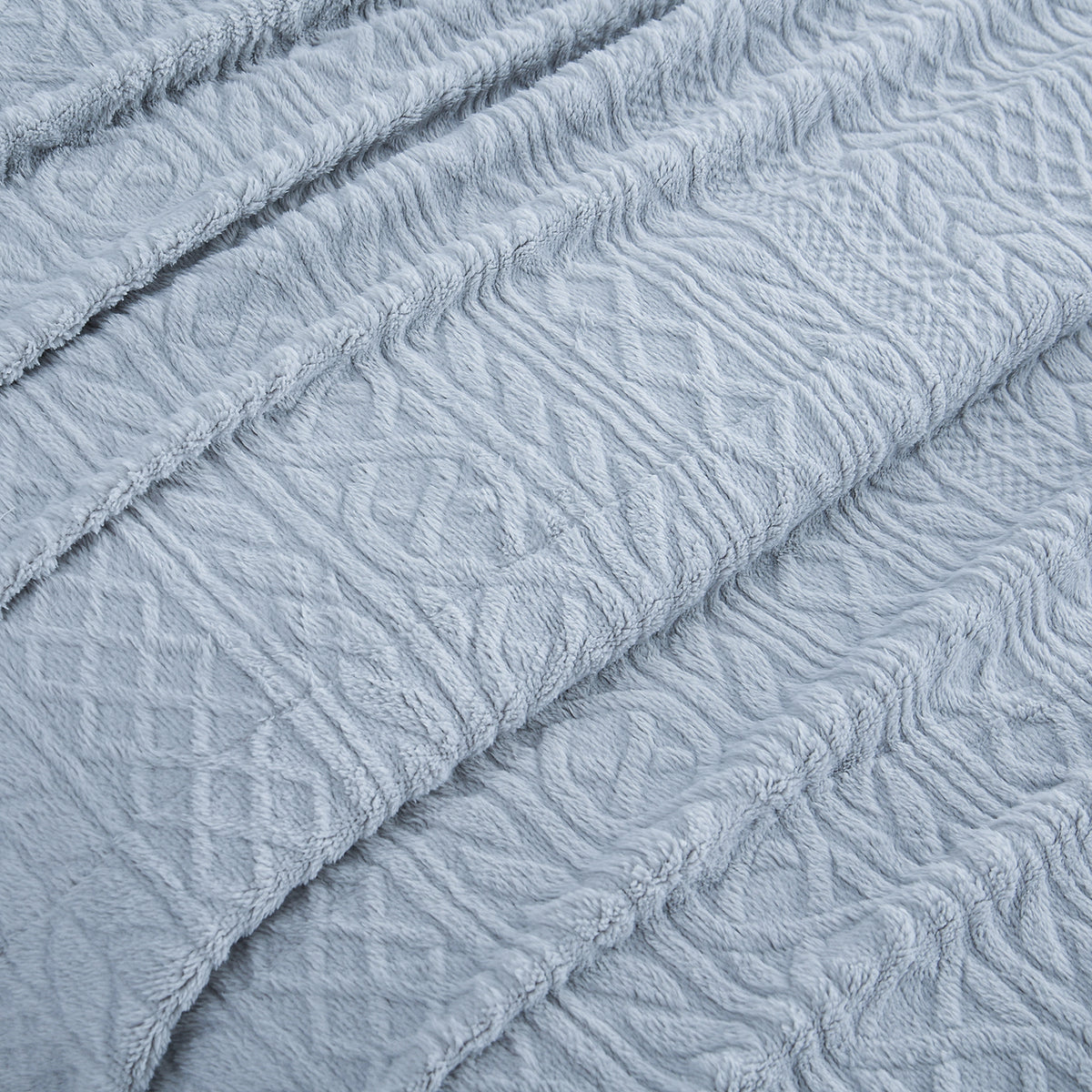 Close-up of the raised cable pattern on the VelvetLoft® Plush Sheet Set in Textured Polar Blue