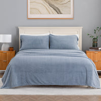 VelvetLoft® Plush Sheet Set in Textured Polar Blue on a made bed with a cream headboard, front view