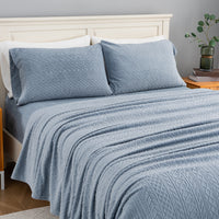 VelvetLoft® Plush Sheet Set in Textured Polar Blue on a made bed, angled view