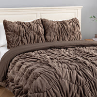 A brown ruched VelvetLoft Comforter Set decorated on a bed in a bright room.