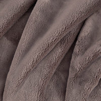 Close up of a grey PrimaLush Throw displaying its plush texture.