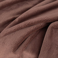 A close up of a brown PrimaLush Throw displaying its plush texture.