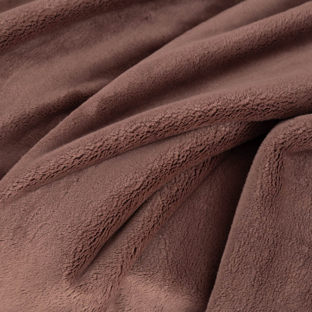 A close up of a brown PrimaLush Throw displaying its plush texture.