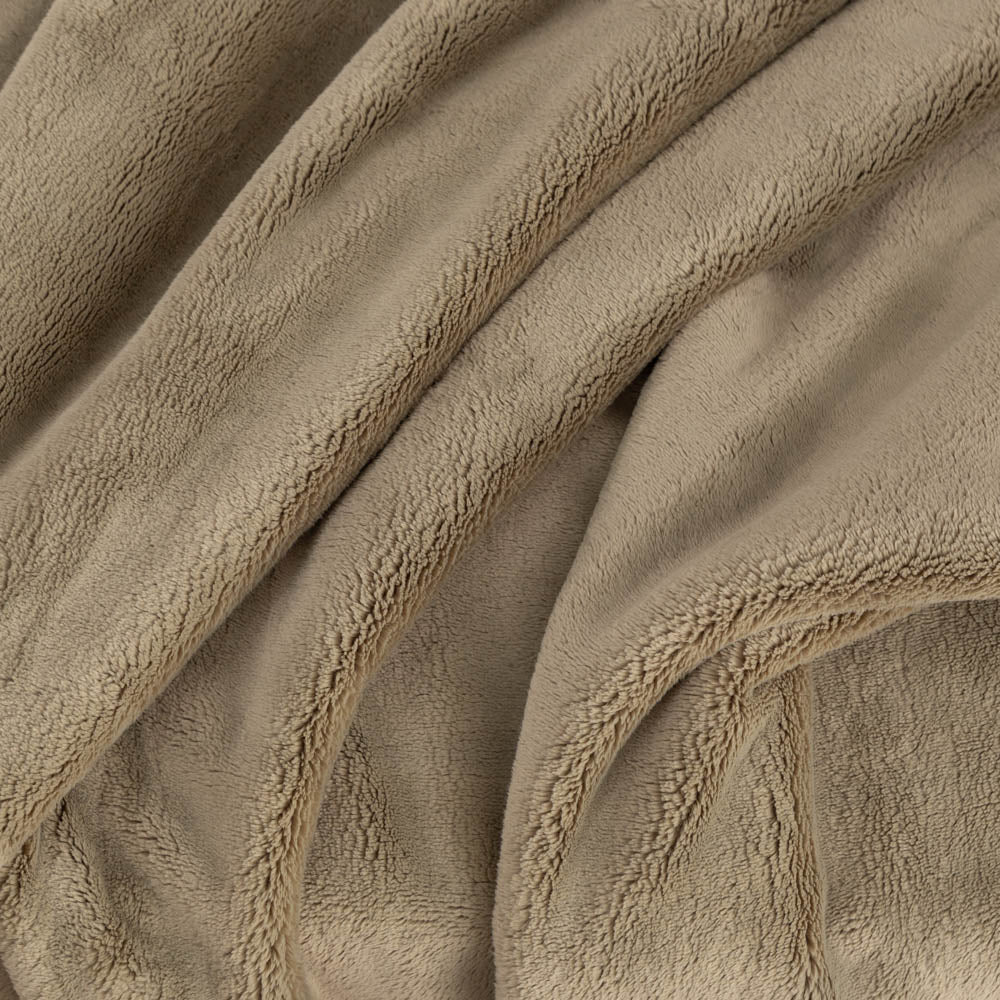 A close up of a green PrimaLush Throw displaying its plush texture.
