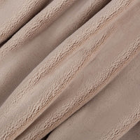 Close up of a beige PrimaLush Throw displaying its plush texture.
