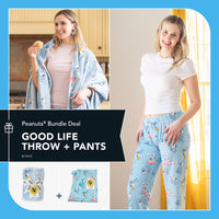 Woman wearing a 'Good Life' throw and pants set with 'Peanuts' branding.